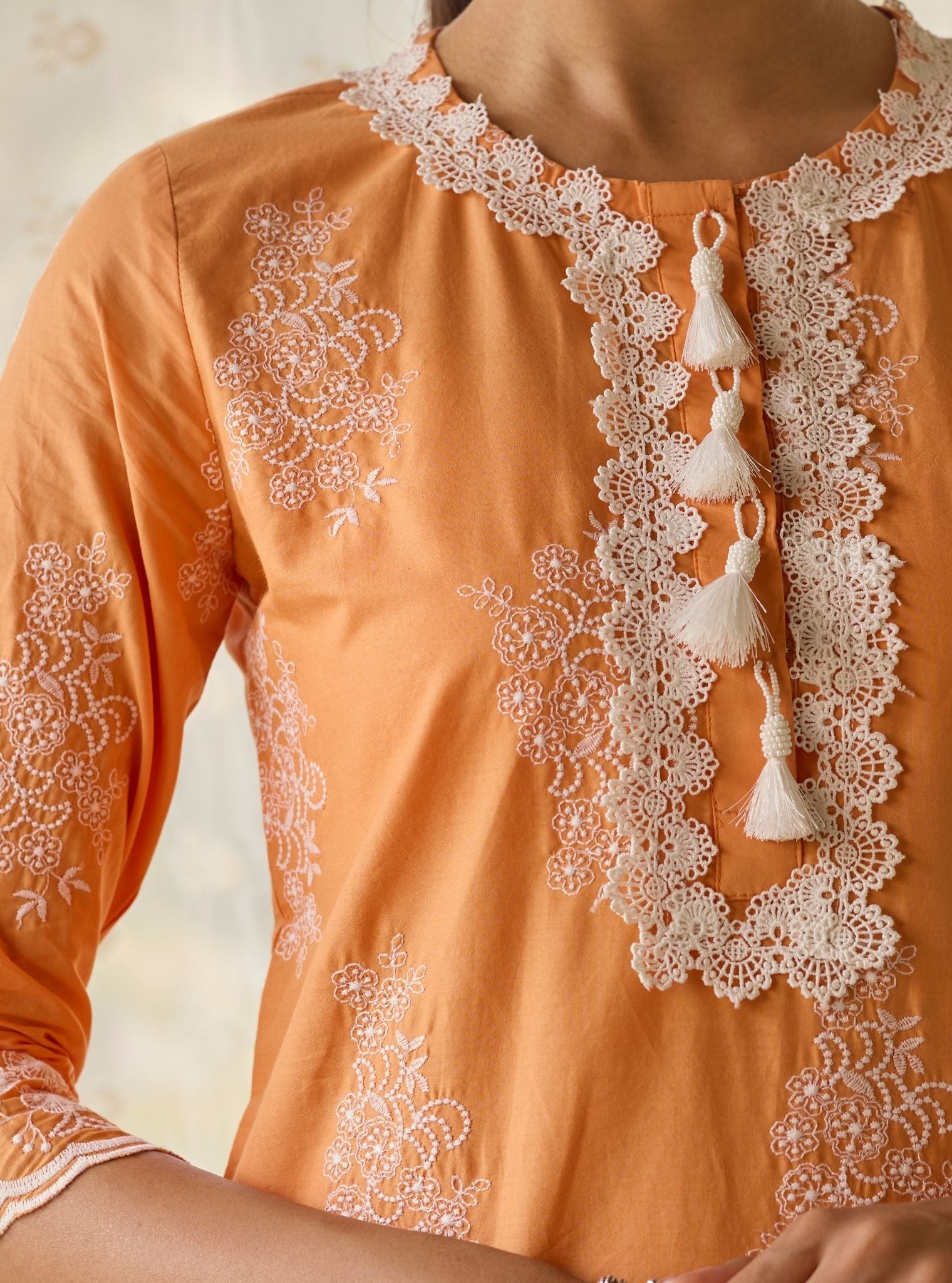 Perla Supima Cotton Orange Kurta with Floral Lace Flared White Pant Set