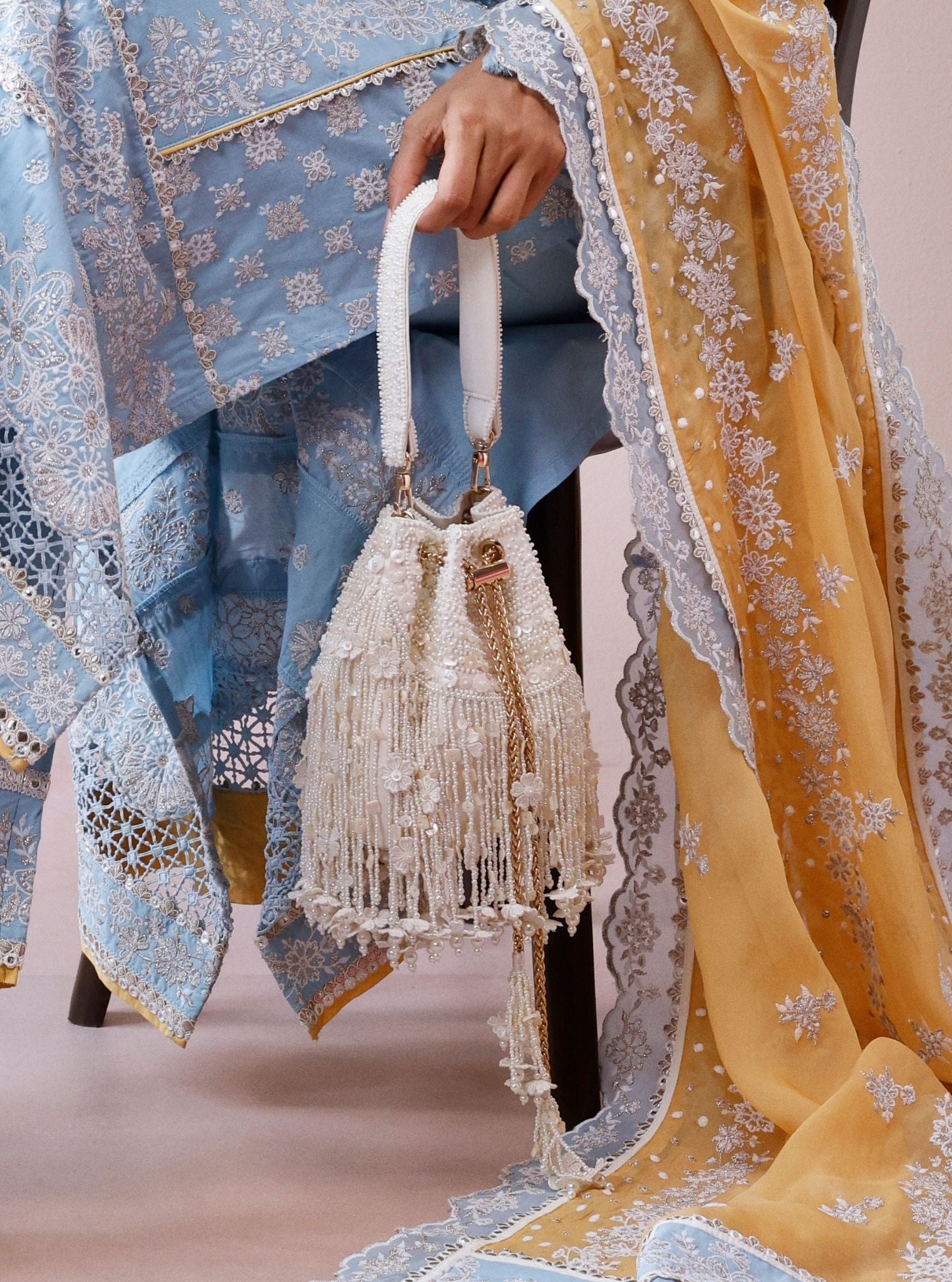 Snow White Floral Tassels Offwhite Potli Bag