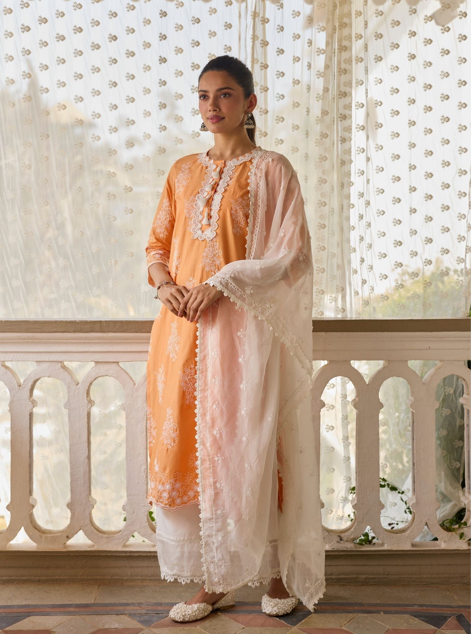Perla Supima Cotton Orange Kurta with Floral Lace Flared White Pant Set